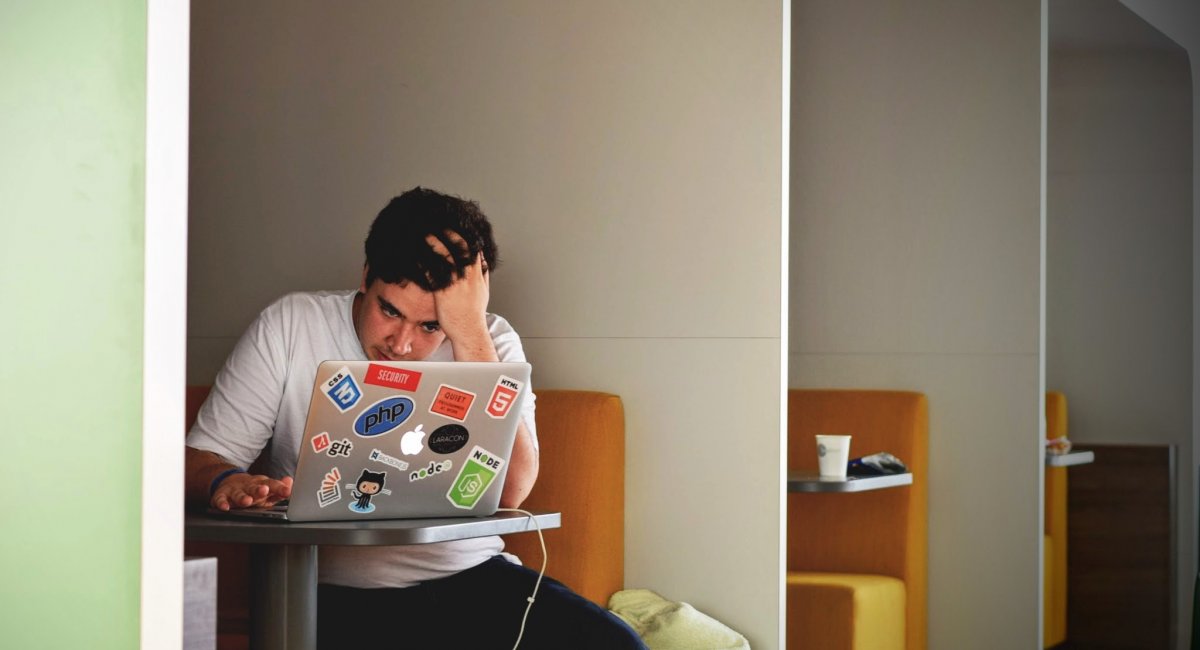 Looking for a job opportunity online Man in White Shirt Using Macbook Pro