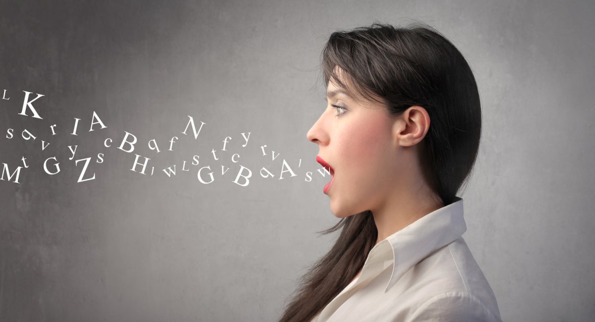 Woman with alphabet letters coming out of her mouth.