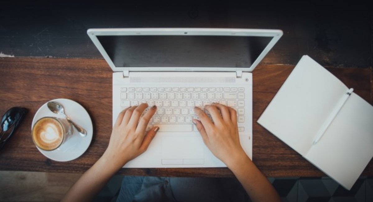 woman's hands on laptop keyboard