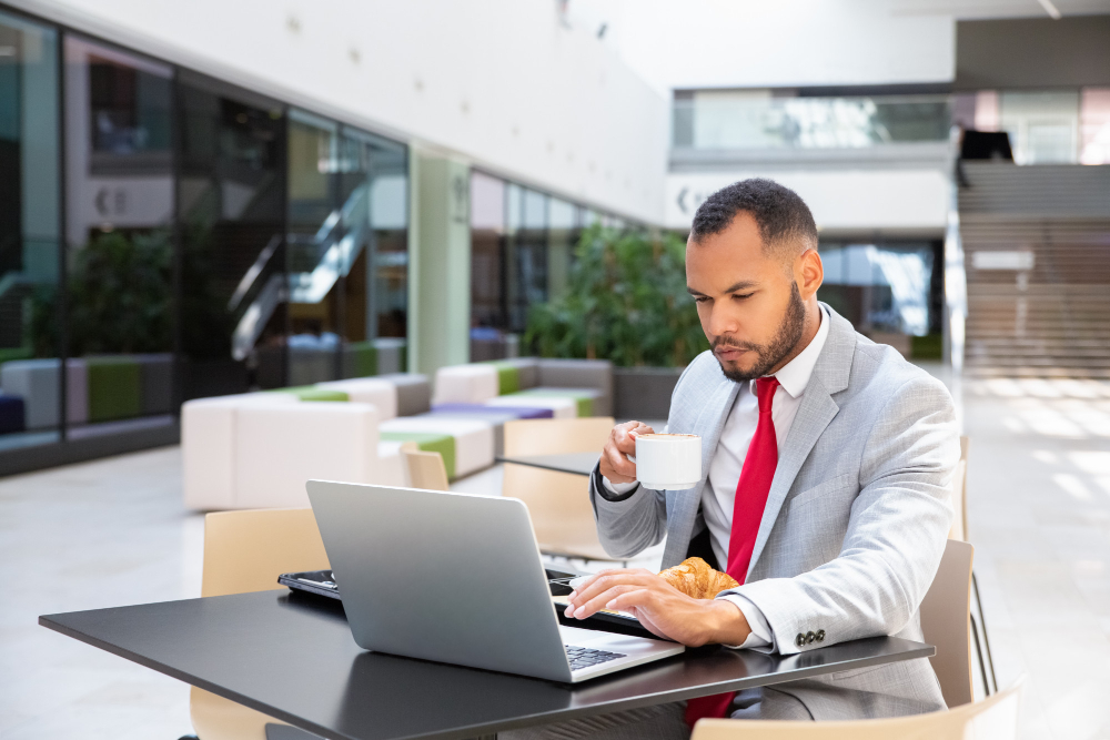 Focused businessman having breakfast