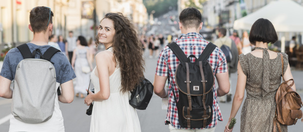 A group of friends walking on a street