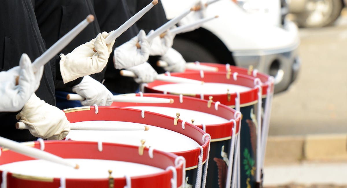 Group of people playing drums during daytime