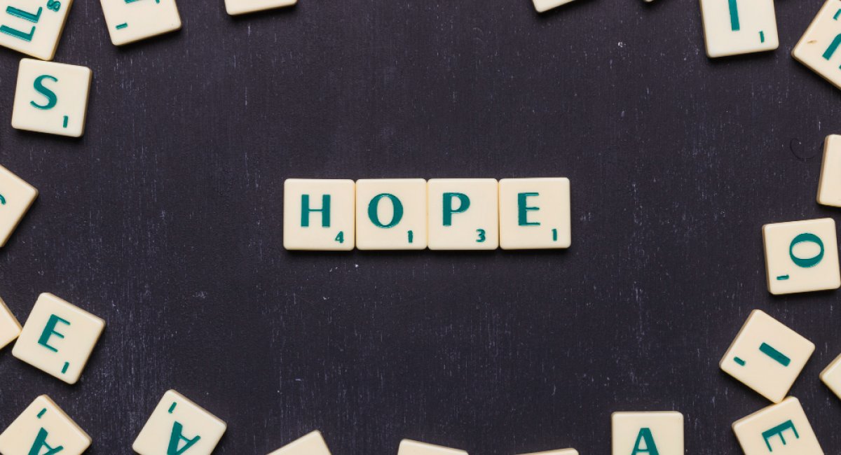 Scrabble letters against black background