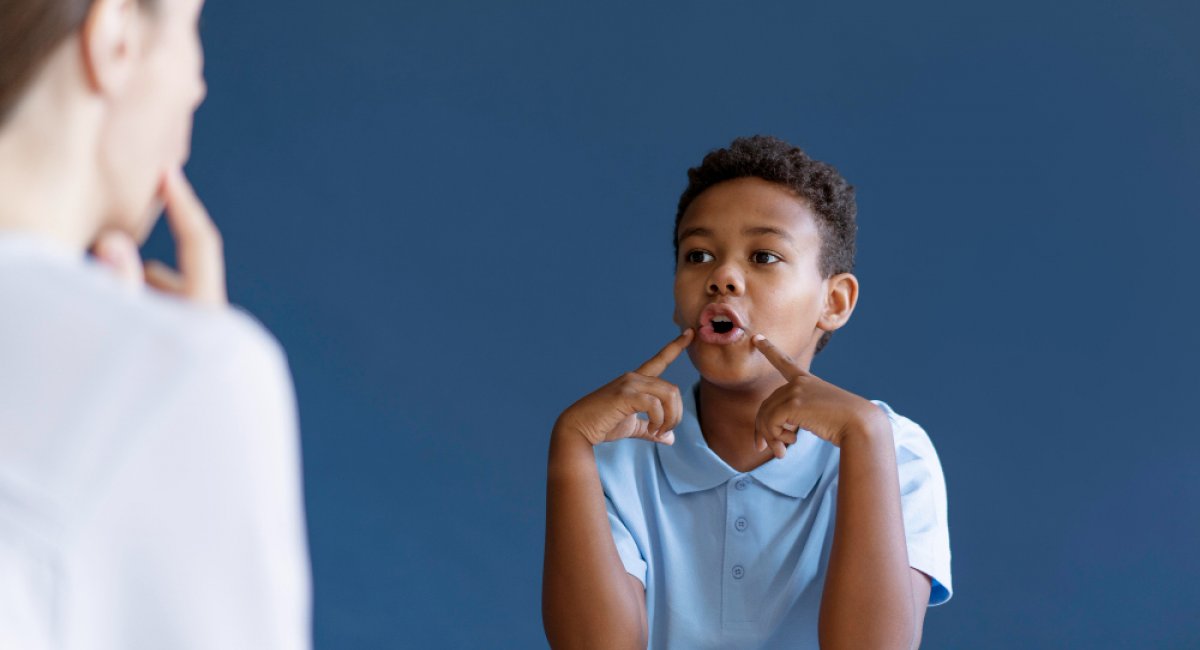Little boy having an occupational therapy session with a psychologist
