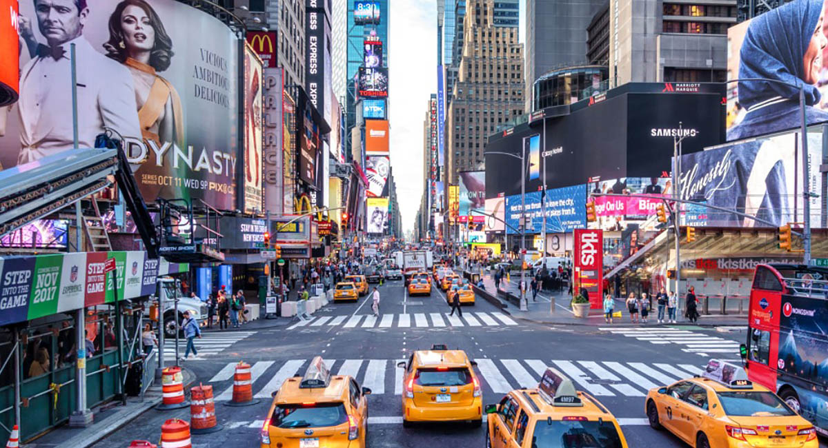 crowded city street with signs in English