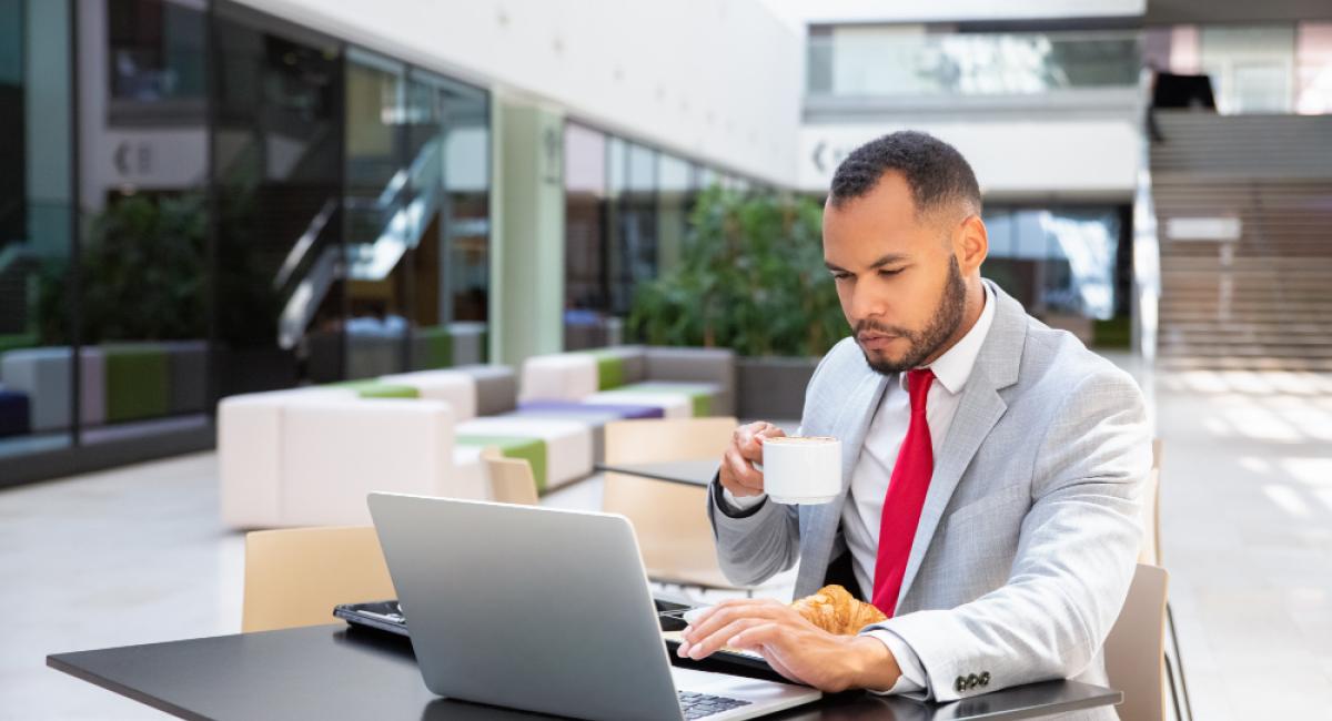 Focused businessman having breakfast