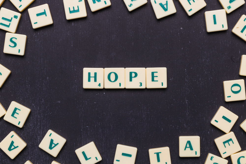 Scrabble letters against black background