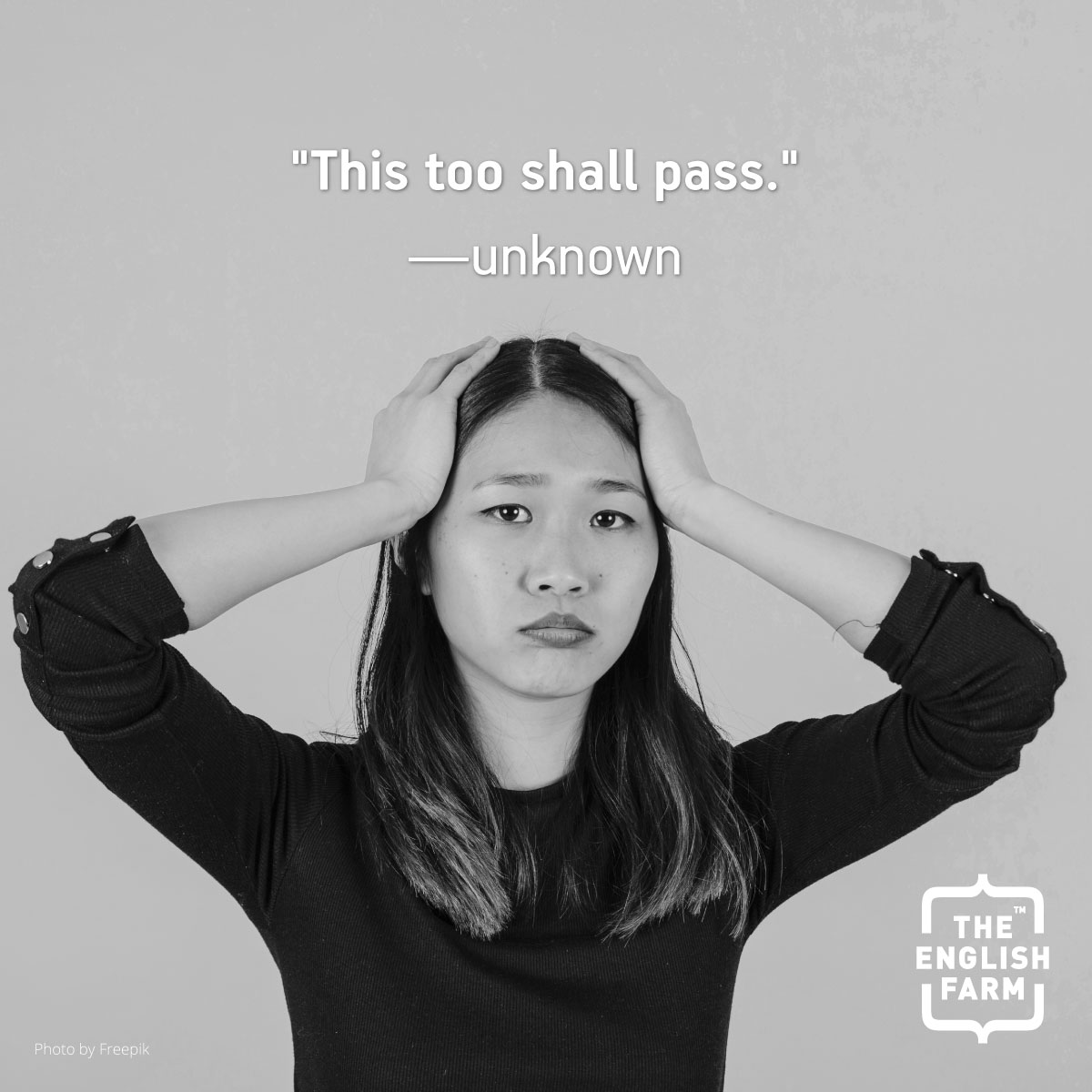 A woman holding her head in her hands