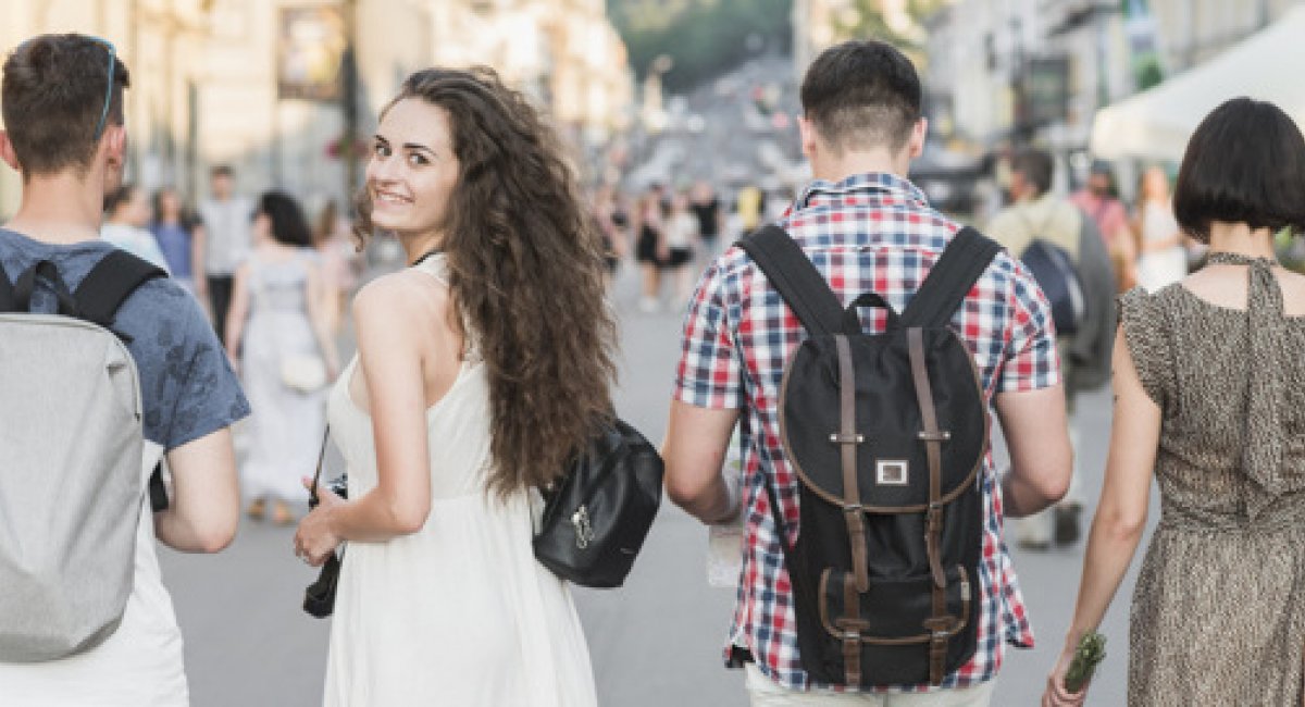 A group of friends walking on a street